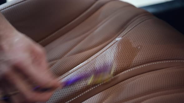 Using Brush To Wipe and Polish Leather Seats From Dust and Dirt alt