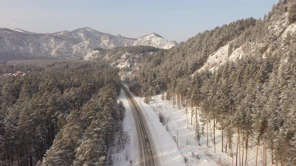 Aerial Drone View of Winter Road Among Altai Mountains