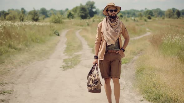 Man On Safari Clothes Style.Inspiration Travel On Africa.Stylish Outfit On Wildlife Landscape. alt