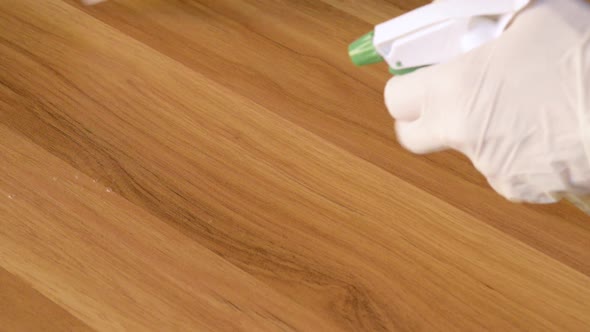 Hands wipe the table handle with disinfectant cloth. Necessary method to prevent spreading of Corona alt