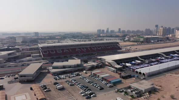 Aerial view of empty Dubai Autodrome grand stand, paddock and race track