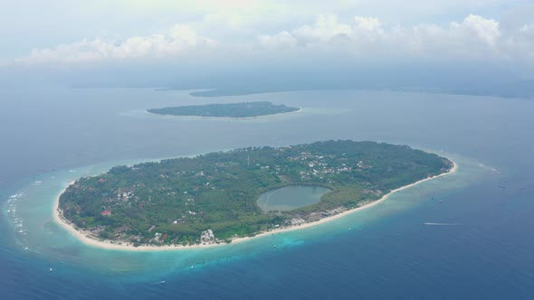 Gili Island with Lovely Tiny Buildings Surrounded By Green Forest, Indonesia alt