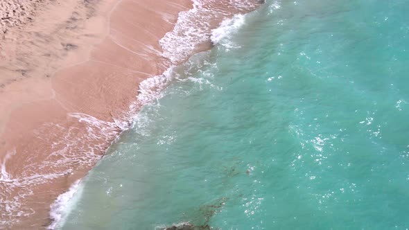 Fine Sand Of Balangan Beach Are Washed By The Foamy Ocean Waves alt