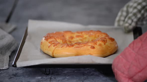 Freshly Baked Khachapuri with Cheese on a Baking Sheet