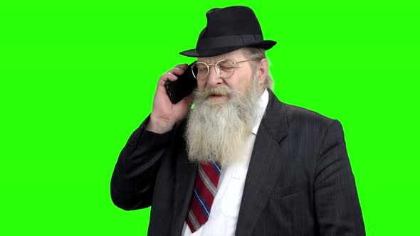 Confident Senior Businressman Talking on Phone alt