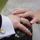 LGBT wedding. Close up of newlyweds hands with pride rainbow emblem elements. Nail rainbow manicure - VideoHive Item for Sale
