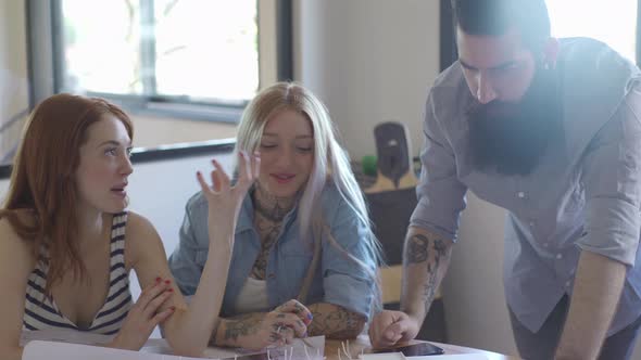 Aspiring architects working on project together alt