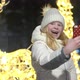 Beautiful Blonde Takes Selfie with Smartphone on Christmas Decorated Street in Winter - VideoHive Item for Sale