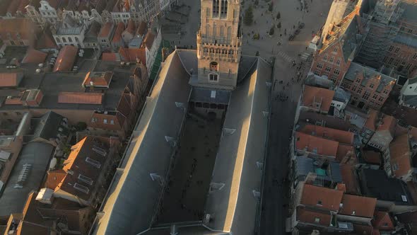 Flying over Belfry of Bruges to reveal city alt