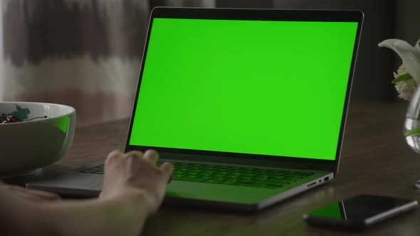 Close Up of a Caucasian Woman Hand Rest on a Laptop Computer Touchpad with Green Screen Chroma Key alt