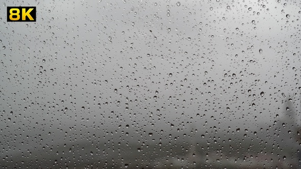Water Drops of Rain on Wet Window Glass Surface alt