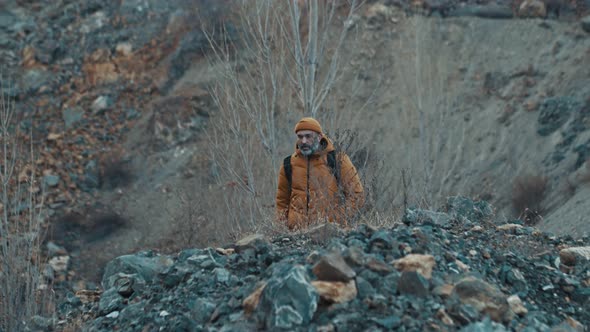 Hiker Photographer Taking Picture of Morning Landscape in Autumn Mountains alt