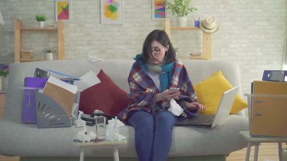 Business Woman Workaholic Sick Sneezes Sitting on Sofa and Working at Home alt