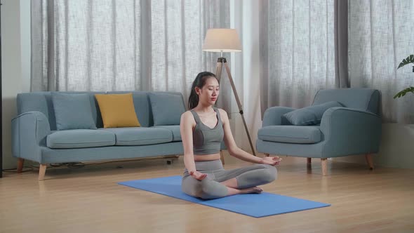 Asian Athletic Female Meditating During Workout On Yoga Mat At Home. Healthy Lifestyle, Fitness alt