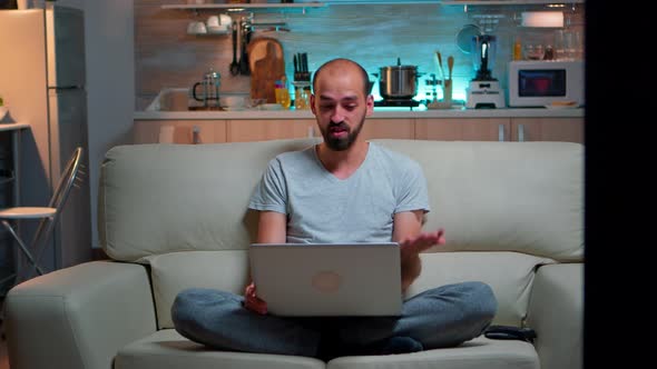 Focused Man Talking with Business People During Online Meeting Videocall alt