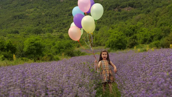 Child with Balloons