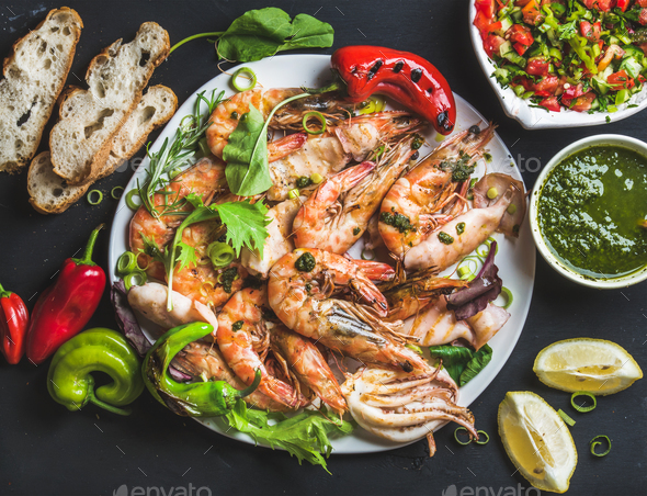 Plate of roasted tiger prawns and octopus - Stock Photo - Images