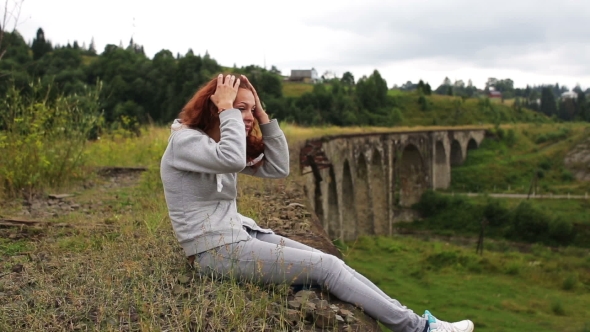 Girl Sitting On The Old Viaduct alt