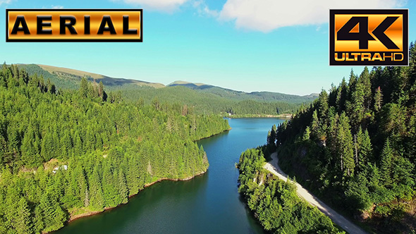 Fly Over Mountain Lake In A Sunny Day alt