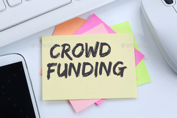 Crowd funding crowdfunding collecting money online investment internet business concept desk