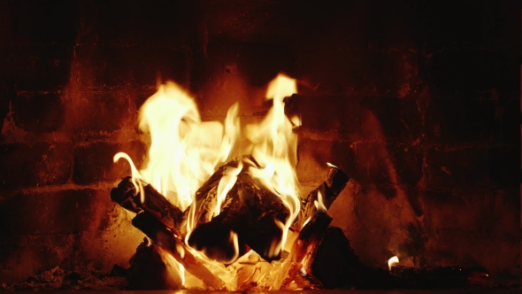 Fire Burns In The Fireplace alt