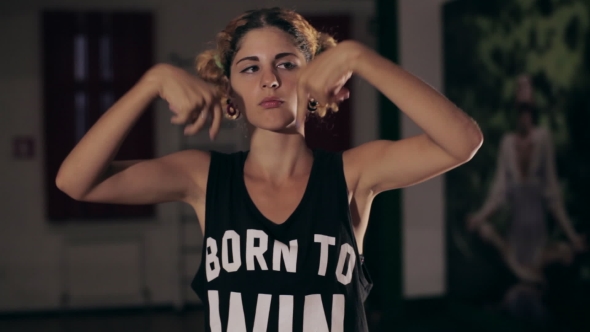 Young Cute Girl Dancing In Dark Studio alt