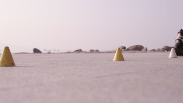 Legs Of Teenager Having Roller Skate Exercise In Public Park