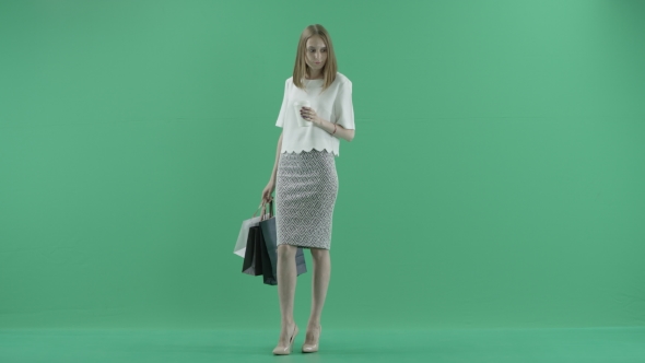 Young Woman With Shop Bags alt