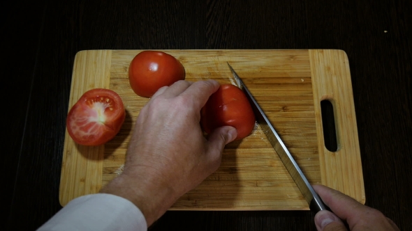 Chef Cuts Red Tomatoes For Salad