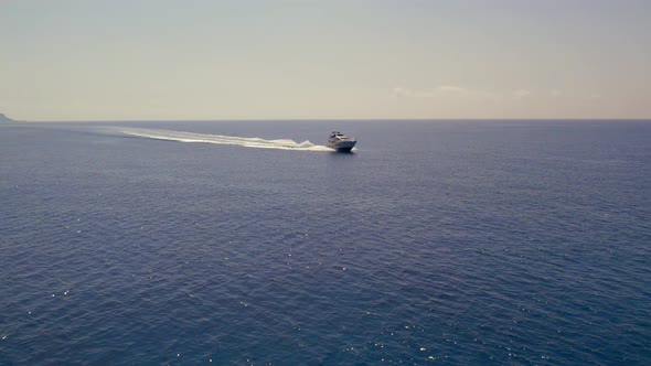 Drone Aerial Footage of Speedboat in the Blue Turquiose Mediterranean Sea in Cyprus Summer alt