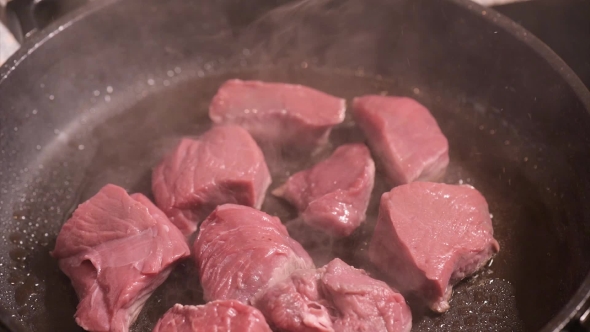 Frying Meat On Hot Pan