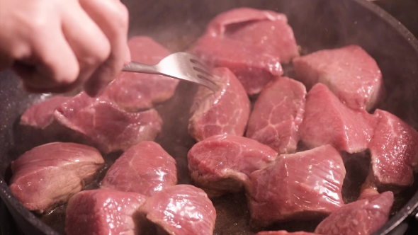 Frying Meat On Hot Pan