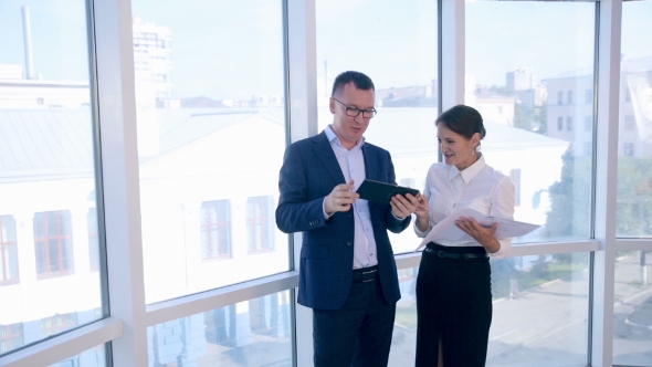 Business, Architecture And Office Concept. Two Successful Businessmen Discuss Project On Tablet In alt