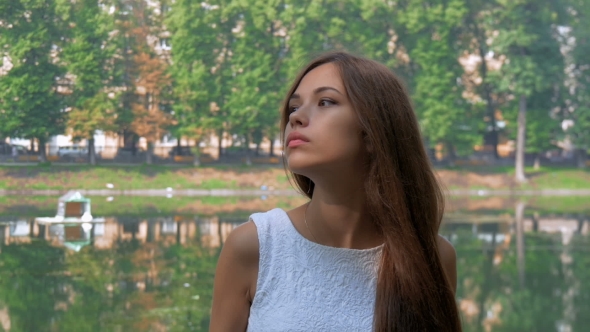Attractive Young Girl Waiting For His Girlfriend For a Walk.