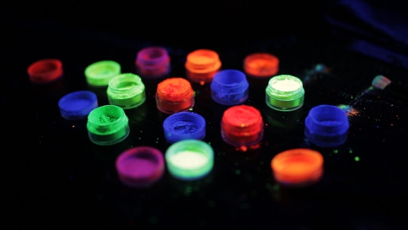 Jars With Colored Fluorescent Powder In Ultra-violet Light