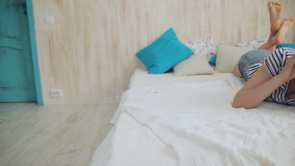 Teen Girl Talking On The Cell Phone At Home alt