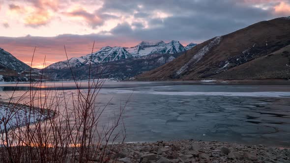 Time lapse moving on slider during colorful sunset over Deer Creek Reservoir alt