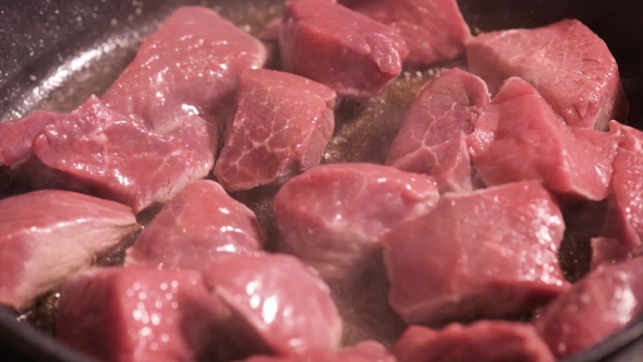 Frying Meat On Hot Pan