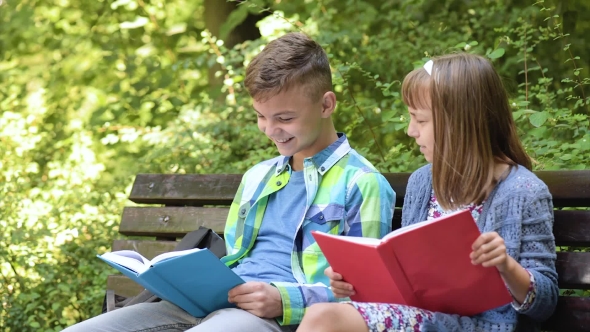 Boy and Girl Reading Book