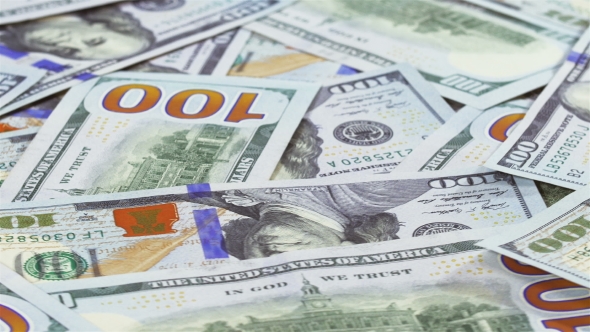 Many 100 US Dollars Bank Notes Rotating Business Background