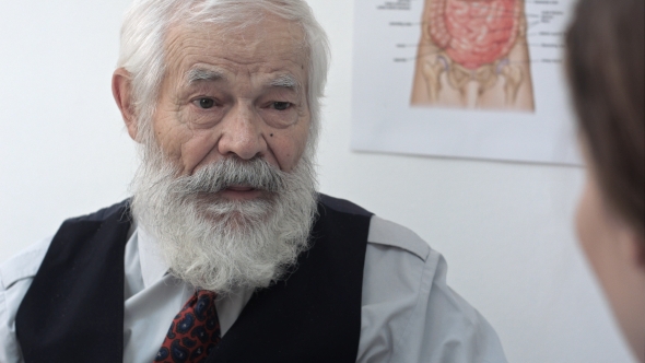 Senior Patient Telling Doctor About Neck Pain alt