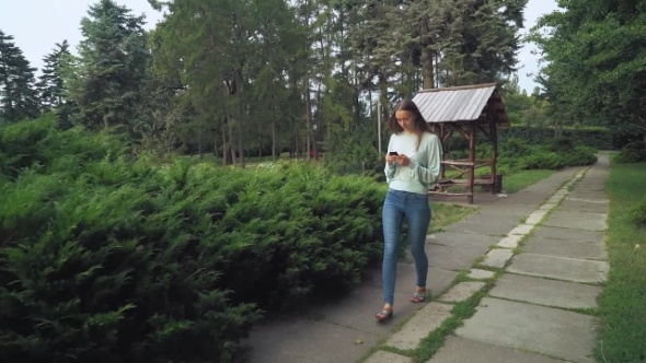 Girl In Green Blouse Goes On The Track With The Phone, Takes Messages And Looking Sideways.
