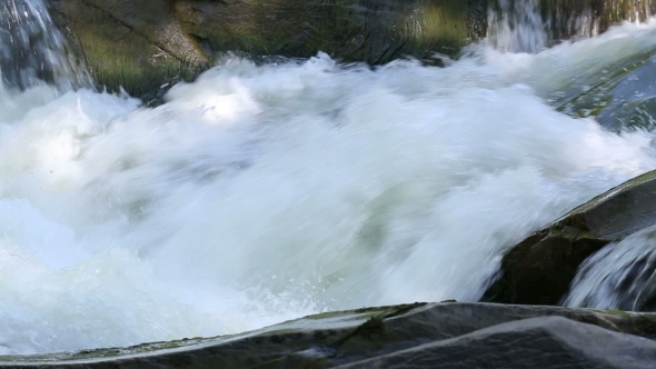 The Water Flow In The Mountain River.
