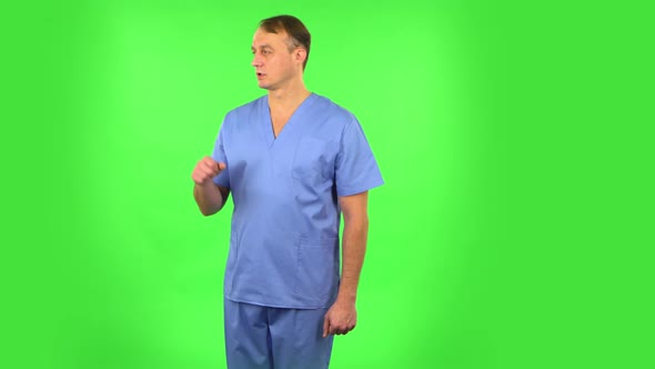 Medical Man Talking and Pointing Side Hand for Something, Copy Space. Green Screen alt