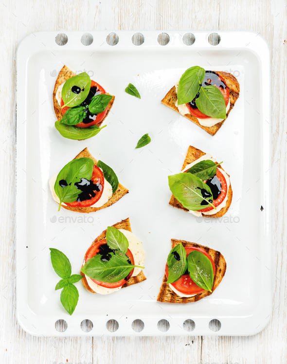 Caprese sandwiches with tomato, mozzarella cheese, basil and balsamic glaze - Stock Photo - Images