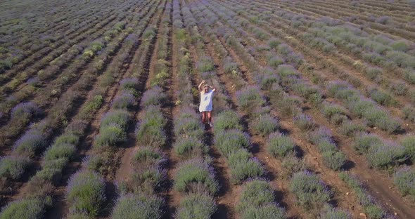 Aerial Drone View of Happy Blonde Woman in Lavender Field