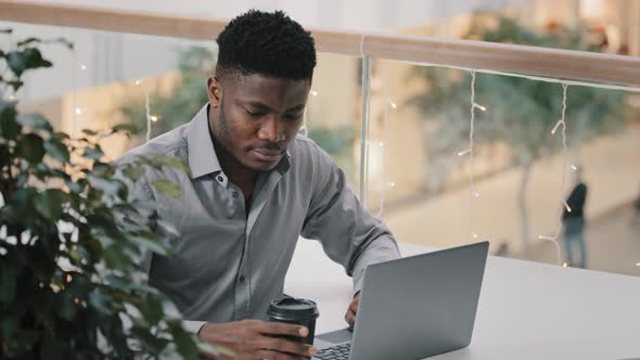 Young Serious Man Working on Laptop Professional Manager Using Computer Application Student alt