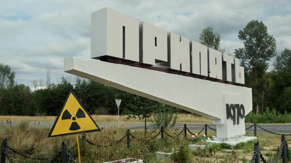 Pripyat Road Sign with Radiation Hazard a Ghost Town Near Chernobyl Exclusion Zone alt