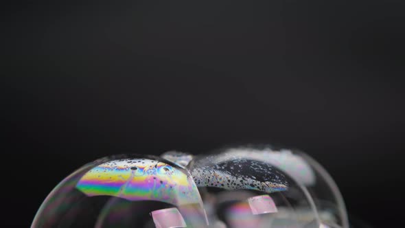 Soap bubbles isolated on black background. Abstract soap bubbles with colorful reflections. F1 alt