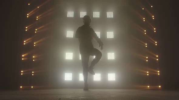 Breakdance Concept. Trendy Young Man Dancing Single in Club, Neon Light, Lots of Smoke. Fashion alt